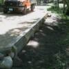 Completed wall. Truck shows scale of wall and driveway.