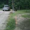 Area along side of driveway designed as decorative/ functional boulder edge and native grass planting. 